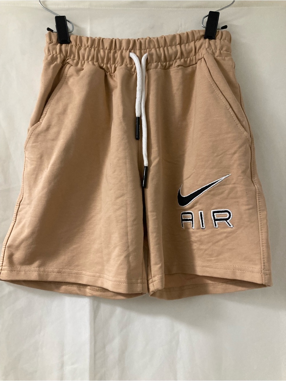 Nike Women's Tan Athletic Shorts with Black Swoosh